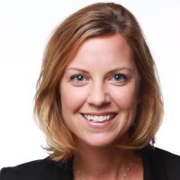 Professional headshot of a smiling woman with blonde hair.